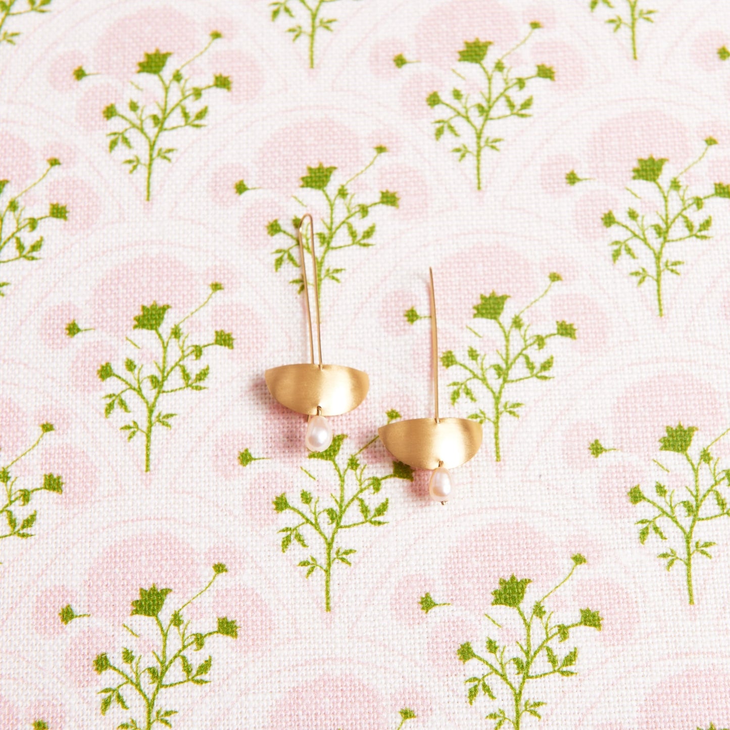 gold and pearl earrings by 11th house