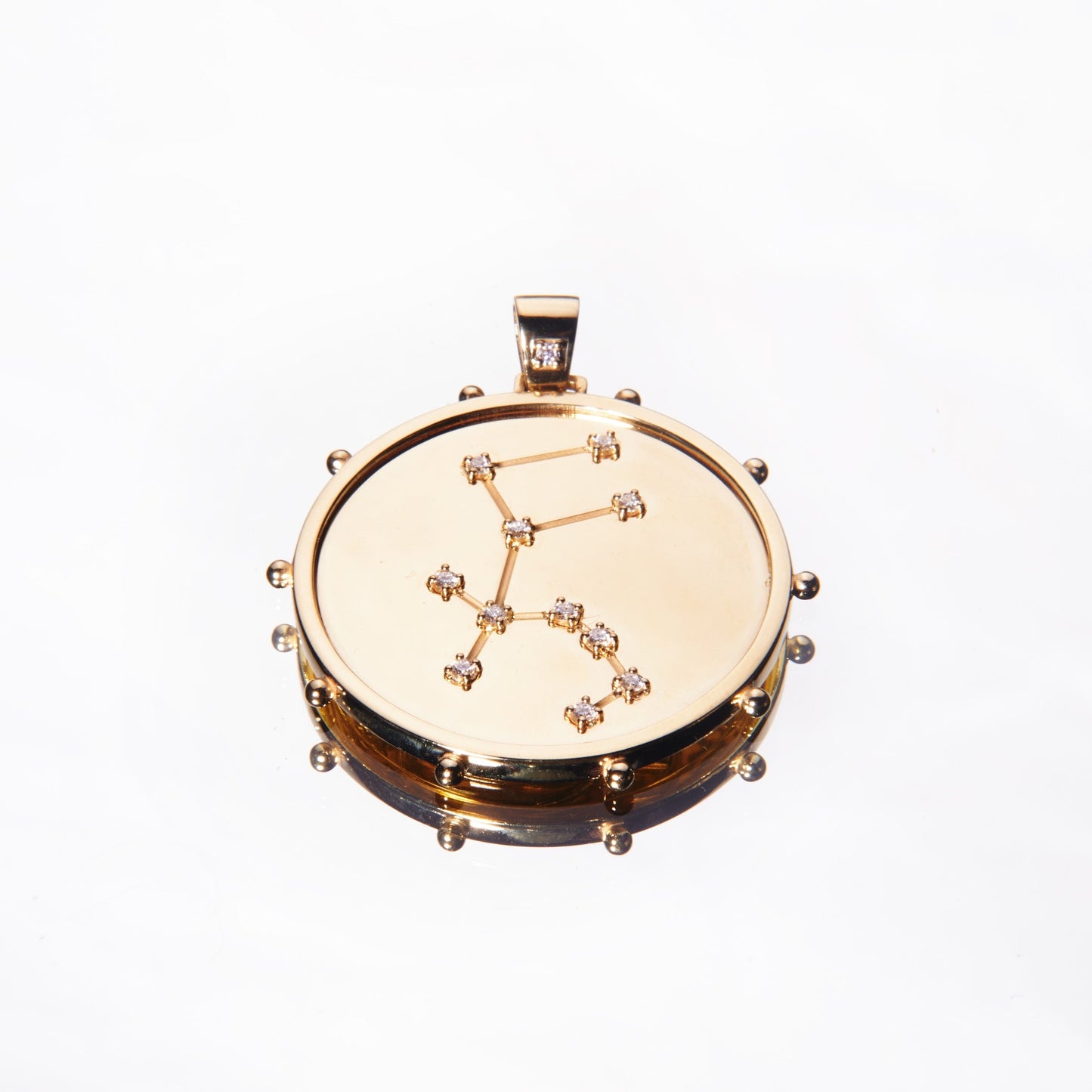 Gold pendant with astrology star design with diamonds by 11th house