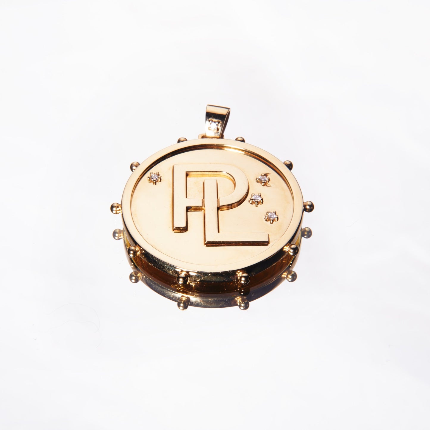 Gold pendant with monogram with diamonds by 11th house