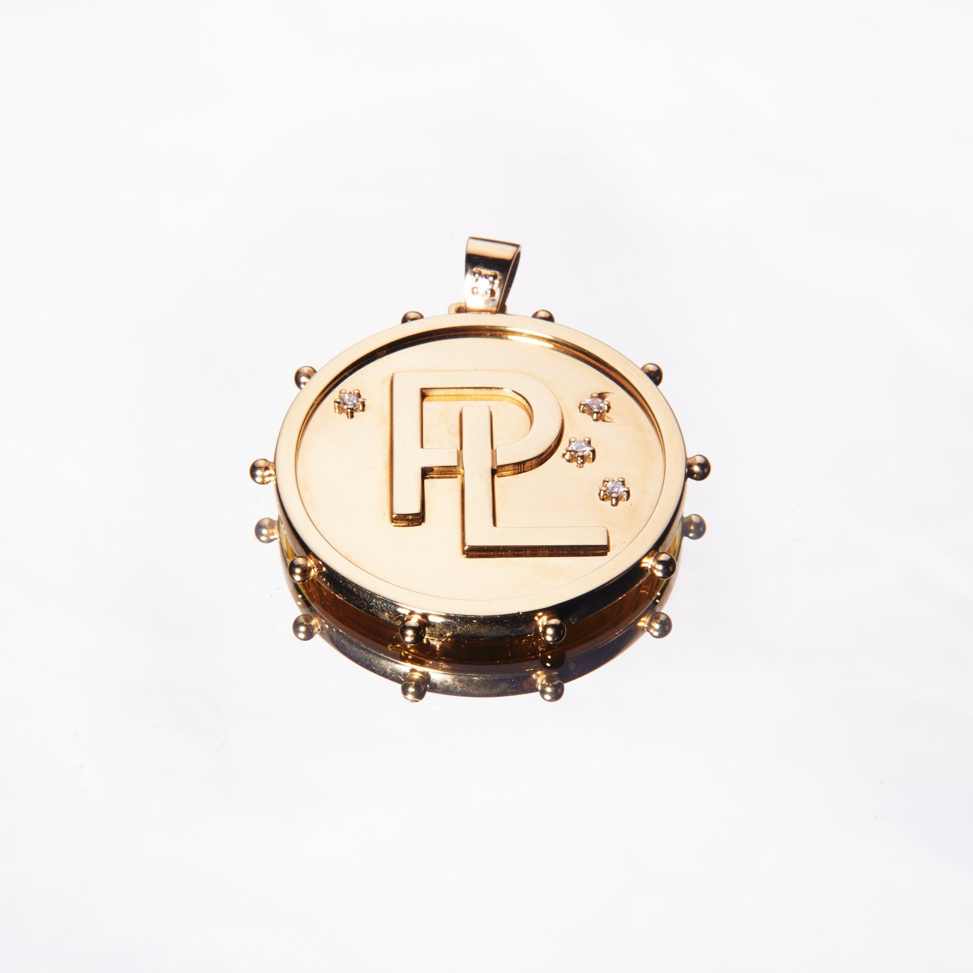 Gold pendant with monogram with diamonds by 11th house