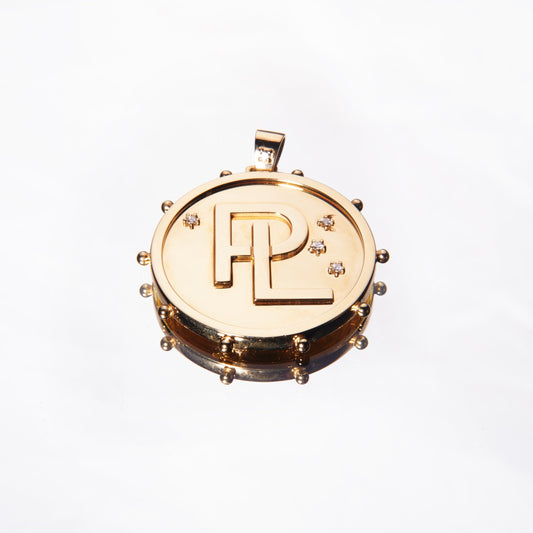 Gold pendant with monogram with diamonds by 11th house