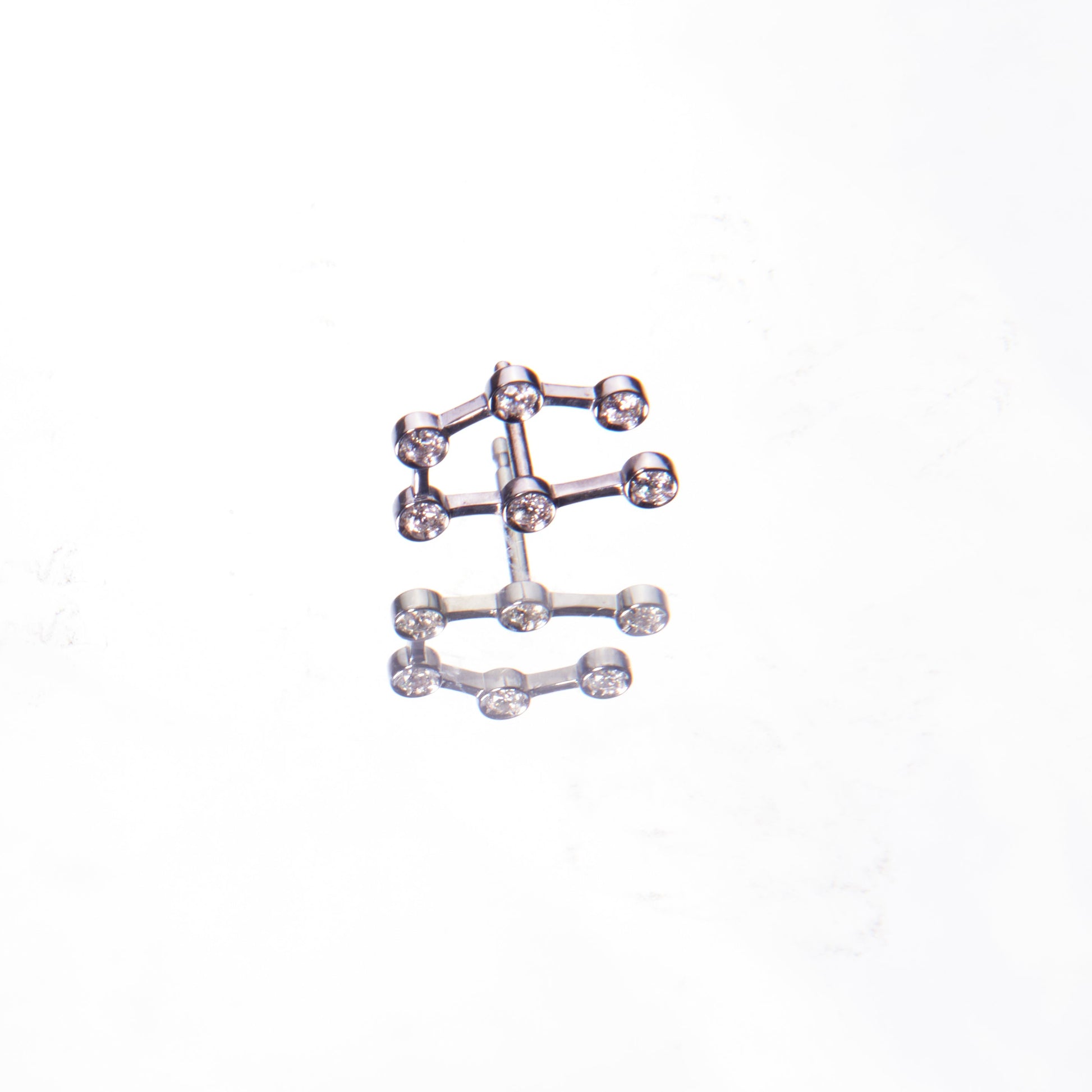 18K white gold and diamonds earring in the shape of a constellation by 11th house