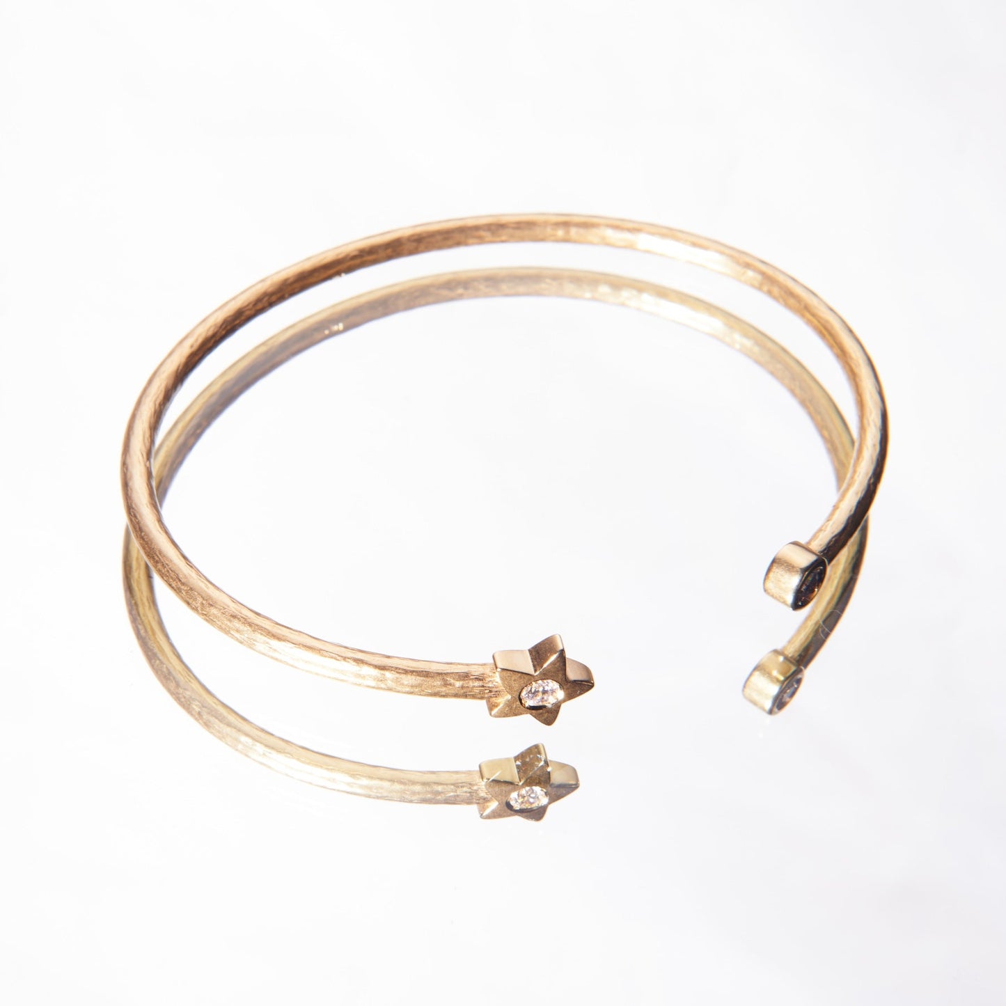 yellow gold bracelet with diamonds and a star detail made by 11th house jewelry