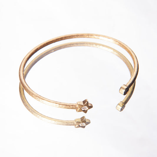 yellow gold bracelet with diamonds and a star detail made by 11th house jewelry